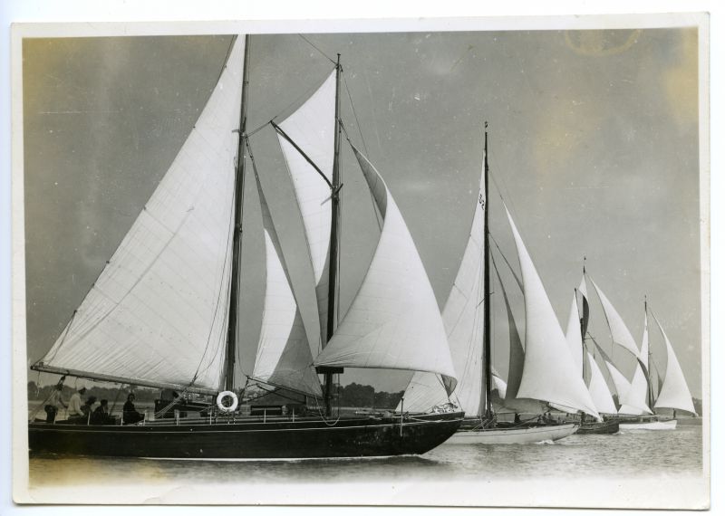  Different types make a fine start at West Mersea. L to R ELVER wishbone schooner - she was was a gaff schooner and the change over gave her 20% greater speed. SPOSA (?) Bermuda cutter. Gaff cutter smack and the yawl THALASSA. D Went name is pencilled on back. 
Cat1 Yachts and yachting-->Sail-->Larger Cat2 Mersea
