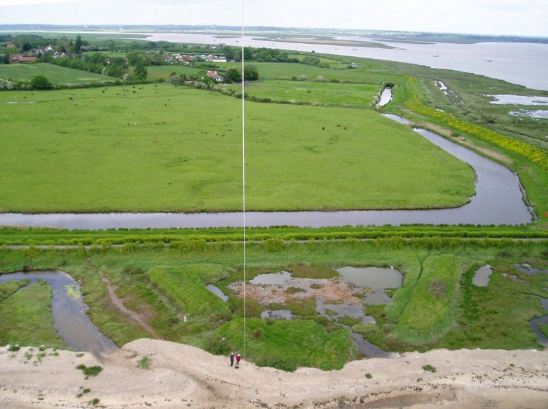  Blockhouse Fort, East Mersea. An aerial view from a kite, looking north. The fort had earth walls and was triangular. The remains are in the lower half of the picture, with two walls pointing to the south. The point is now covered by the beach. The third wall, which would have been across the centre of the picture, is thought to have been destroyed when the sea wall was built.

The fort was ...
Cat1 Aerial Views-->Mersea Cat2 Mersea-->East