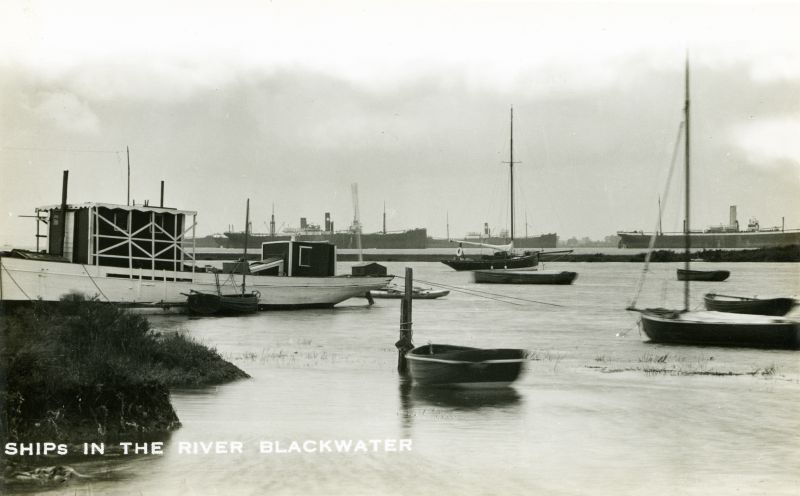  Ships in the River Blackwater, taken from Bradwell.
The vessel on the right is BENGUELA, broken up September 1933. 
There are two Houlder Bros vessels in the picture - they look identical. One is possibly the ORANGE RIVER, which was laid up in the Blackwater December 1932 [T&M Oyster Company records] 
Cat1 Blackwater-->Laid up ships Cat2 Places-->Bradwell