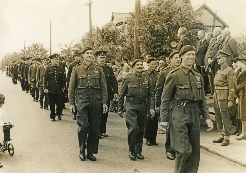  Royal Observer Corp marching in the parade during Wings for Victory Week. Herbert Marrow is in the centre of the picture, in the centre of the leading row.

6 x 8 photograph from F.W. Straw, 9, St John's St., Colchester.

Notes from Ron Green

The parade is being led by Freddie French with Herbert Marrow in middle of the first row. To his right I believe is Vic Mussett and be ...
Cat1 War-->World War 2 Cat2 Families-->French Cat3 Families-->Mussett
