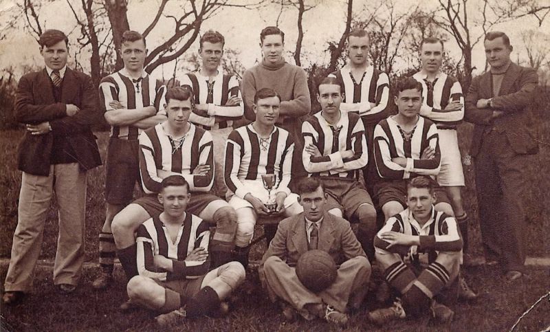  West Mersea Football Team. Tiddler Mole and Bernard (Nig) French - coaches. 

Back row L-R 1. Tiddler Mole, 2. Sid Vince, 3. Joe Hewes, 4. a soldier, 5. soldier, 6. Reg Jay, 7 Bernard 'Nig' French.

Middle row 1. soldier, 2. George Pullen with cup, 3. soldier, 4 ?.

Front row 1. soldier, 2. Pinkey Hewes, 3. Vic Hewes. 
Cat1 People-->Sport Cat2 Families-->French Cat3 Families-->Mole Cat4 Mersea-->Clubs & Organisations