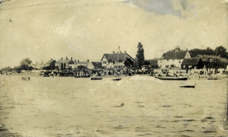  Regatta Day ? Clarke & Carter's boat shed is being constructed extreme right. Note also the black wooden cottage where now stands the Willow Lodge.

[ 'Nutty' Hempstead's shed which was converted to the first Social and Sailing Club. It burnt down and was rebuilt further back from the road. ]

From Album 9. 
Cat1 Mersea-->Regatta-->Pictures Cat2 Mersea-->Coast Road