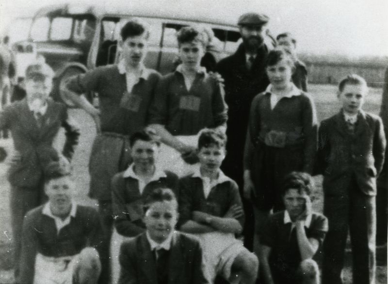  School football team

Back row 1., 2. David Mussett, 3. Cyril Taylor, 4. Mr Hucklesby, 5. Keith Pullen, 6. Brian 'Blackie' Whiting

Middle 1. Robin Cook, 2. Barry Champ, 3. Jeffery carter, 4. James 'Eccles' Mussett.

Front Victor (Claude) Ponder

From Album 9. 
Cat1 People-->Sport Cat2 Families-->Mussett Cat3 Mersea-->Schools-->Pictures