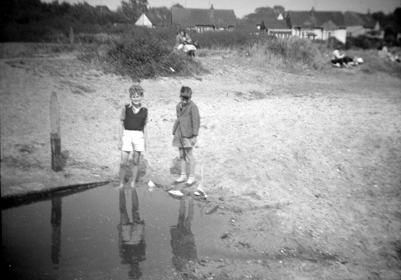  John Tucker (Alan's brothers) and Michael Ralph, by the old boating lake. 
Cat1 People-->Other Cat2 Mersea-->Beach