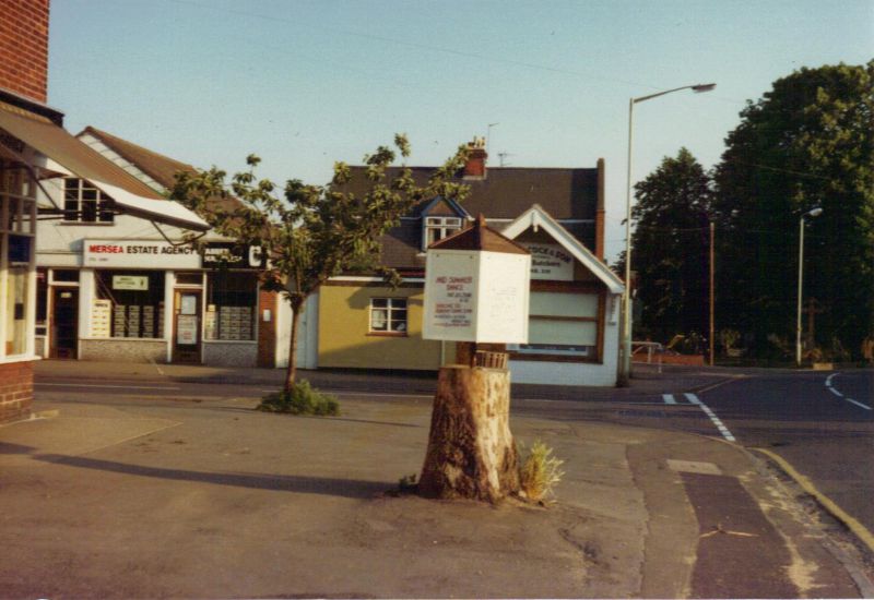  The Rotunda, erected on the tree stump outside the Post Office. Spring 1981. 
Cat1 Mersea-->Road Scenes
