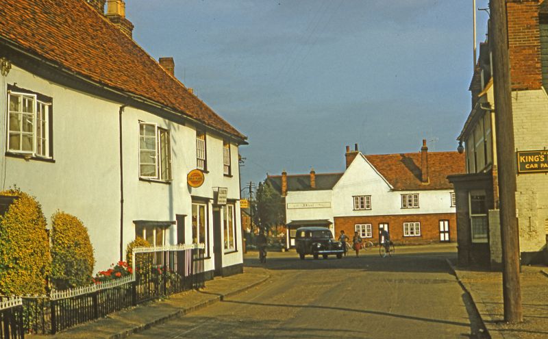  Looking towards Tollesbury Square, with Kings Head on the right.

From a 1950s slide taken by Mary Sime. 
Cat1 Tollesbury-->Road Scenes