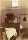  Inside the Strict Baptist Meeting House in Meeting Lane, East Mersea, demolished before WW2. Pulpit. End of the harmonium on the left.  RG03_395