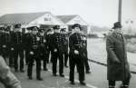 18. ID FL04_035_001 West Mersea Firemen marching in Armistice Day Parade, outside the Griffon Garage.
Roughly L-R 'Ike' Ivan King, Les Phillips, Len Coles, Horace Whiting, ...
Cat1 Mersea-->Fire Brigade Cat2 Mersea-->Events