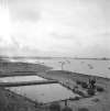 14. ID ATK_035 Ted Woolf oyster pits on Coast Road - just visible distant left is the laid up ship PHILOCTETES, which was in the Blackwater June 1946 to April 1948
Cat1 Mersea-->Coast Road Cat2 Oysters-->Pictures