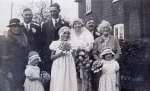 77. ID GWC_009 Wedding of Kate Goody and Ernest Wyncoll. Photograph taken outside Barnard's Cottage, Peldon - home of the bride's parents.
Adults from left to right Emily ...
Cat1 Places-->Peldon-->People