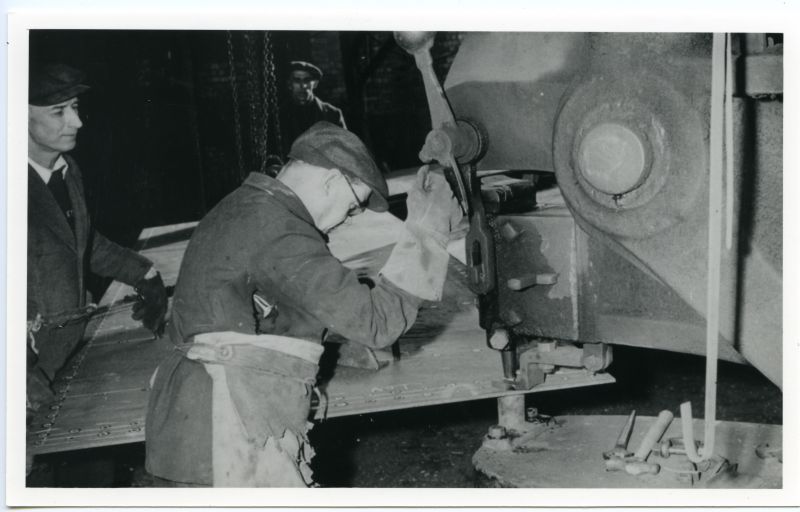 ID BF70_001_026_001 Punching a shell plate at Rowhedge Shipyard on a punch and shears ...