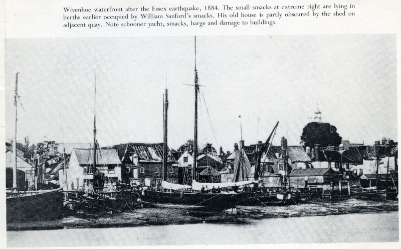  Wivenhoe waterfront after the Essex earthquake, 1884. The small smacks at extreme right are lying in berths earlier occupied by William Sanford's smacks. His old house is partly obscured by the shed on the adjacent quay. Note schooner yacht, smacks, barge and damage to buildings. 
Cat1 Disasters and Mishaps-->on Land Cat2 Places-->Wivenhoe-->Town