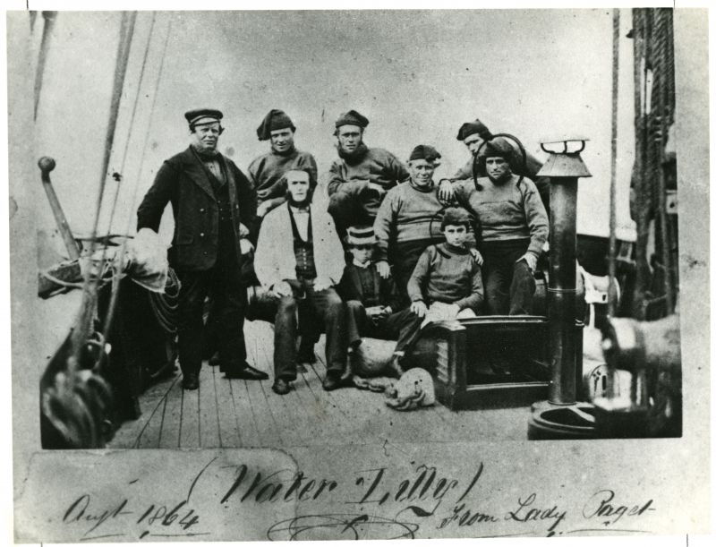  Crew of the yacht WATER LILLY 1864. Owner Lord Alfred Paget. Captain at left, Cook/Steward in white jacket. All Colne seamen from Rowhedge, Brightlingsea and Wivenhoe.

Base of photo says  WATER LILLY Aug 1864 from Lady Paget 

Used in The Northseamen Page 126 where the name is WATERLILY.

Yawl WATERLILY Official No. 29831 was built 1861 by Harvey, Wivenhoe, for Lord Alfred Paget. ...
Cat1 Yachts and yachting-->Sail-->Larger Cat2 People-->Fishermen and Seamen Cat3 Places-->Wivenhoe-->Town