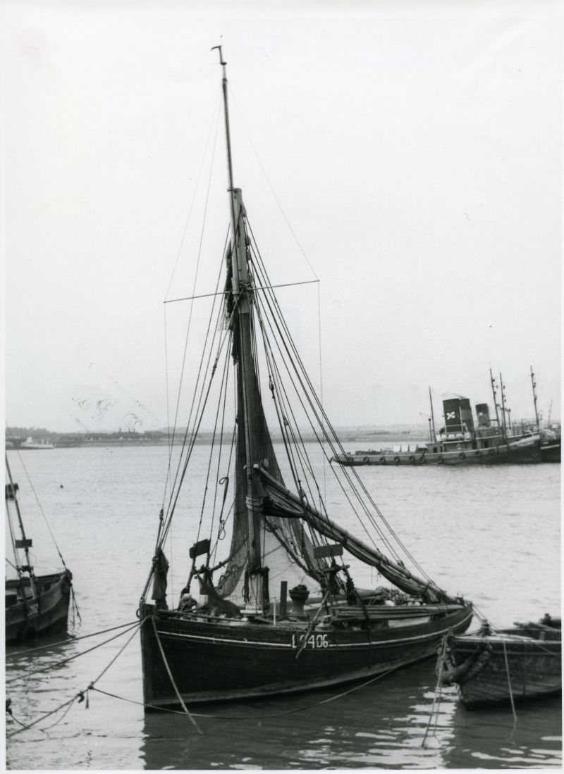  LO406 ( THISTLE ?) moored off Gravesend in the 1930s. A gaggle of ship tugs lie in the background, with CHALLENGE nearest to the camera.

Used in Smacks and Bawleys Page 13. 
Cat1 Places-->Thames Cat2 Smacks and Bawleys Cat3 Ships and Boats-->Tugs