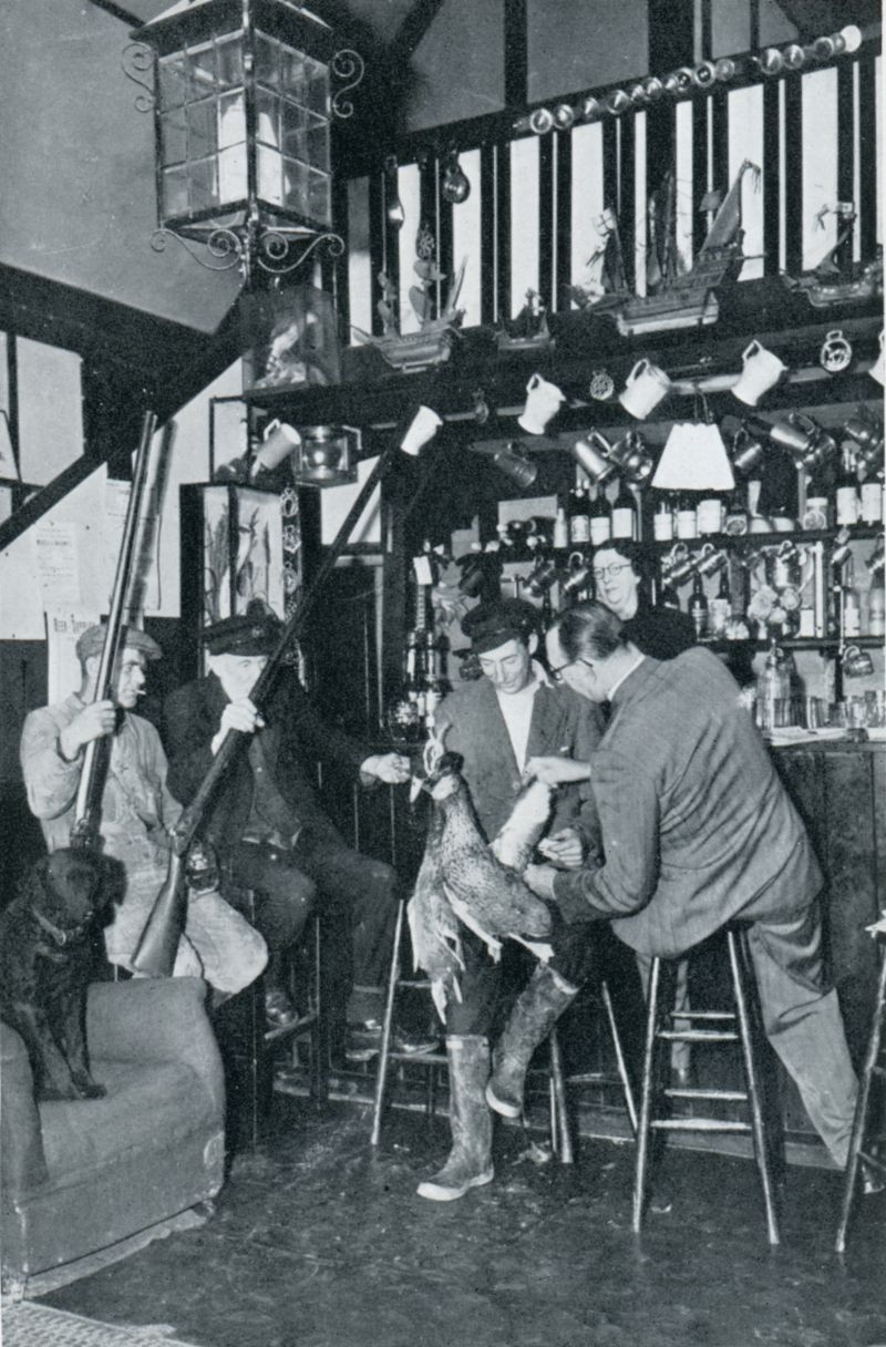  Long guns and tall tales. L-R Bob South, who killed nine Brent geese with one shot from a single 12-bore; 'Admiral' Bill Wyatt, aged eighty-one and still gunning, Ted Milgate and a visitor (Wentworth Day ?), at 'Mrs Hone's' on Mersea Island.

Mrs Winifred Hone behind the bar. Known as the Soc'n Sail, the Social and Sailing Club, it was later the Willow Lodge and is now [2018] the The Coast ...
Cat1 Mersea-->Pubs Cat2 People-->Other