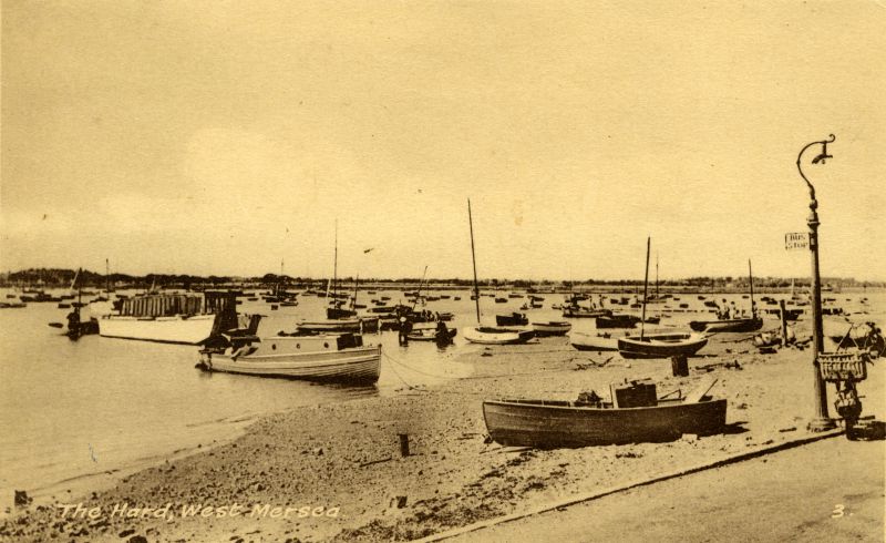  The Hard, West Mersea. Coast Road. Landing craft on the left. Beached in the centre MARY JANE ex THUNDERER, owned by Fred Berry.

Postcard by Moore & Roberts. 
Cat1 Mersea-->Old City & the Hard Cat2 Ships and Boats-->Launches