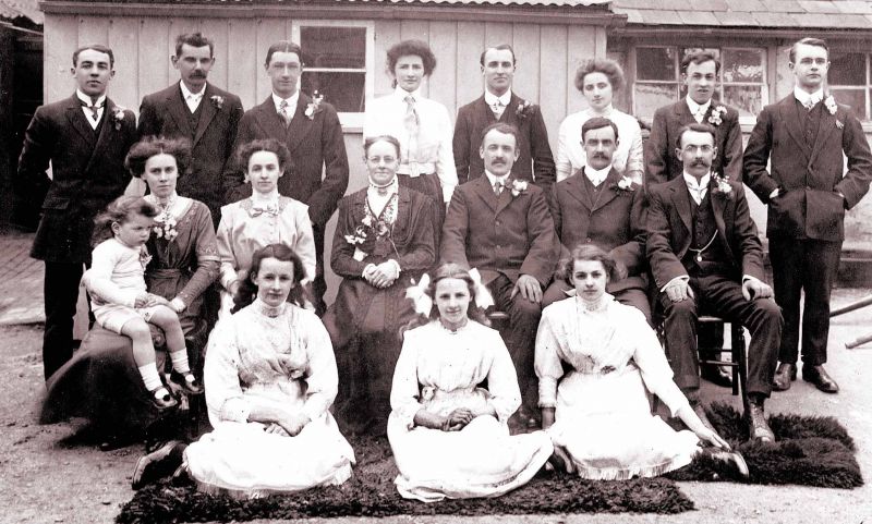  This picture was taken after the marriage of Frances Smith and Frederick George Unwin on 8 April 1912. Frances belonged to the bakery family in Mill Road and the photo was taken outside the mill. Alan Smith has named everyone:-

Back: Thomas Smith, Arthur Cock, Frederick George Unwin (bridegroom), Rosanna Smith, Bertha Smith (Preston's wife née Wade), Herbert Charles Smith, John ...
Cat1 Museum-->DisplayPhotos Cat2 Families-->Smith