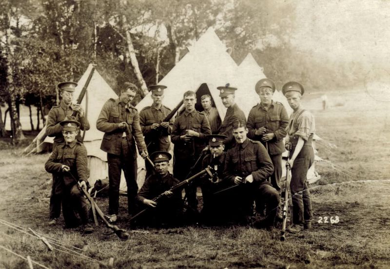  World War 1. 2nd Battalion 'The Rifles' (The Prince Consorts Own). Cleaning rifles.

Fred Peters Rfn 3955 is 3rd from right back row. Stephen Horace Mole is right on front row. 

Stephen Horace Mole Rfn 3581 (Enlisted 30/12/1909) (Discharged 02/02/1919). He is Michael Procter's grandfather.

Postcard thought to be before WW1 - see forum ...
Cat1 War-->World War 1 Cat2 Families-->Mole