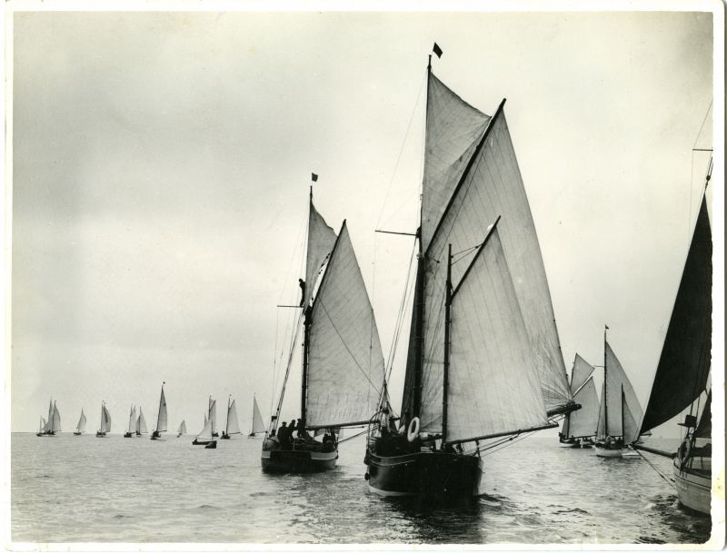  Start of the Little Ship Club's race from Brightlingsea to Ostende. Nineteen small cruising yachts are in sight, with Major Paget's black-hulled cutter-rigged BETSAN in the centre of the picture.

Used in The Sailor's Coast page 104

Douglas Went photograph 
Cat1 Yachts and yachting-->Sail-->Larger