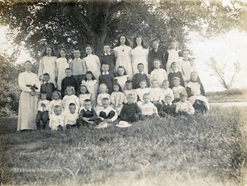  East Mersea School c1907. The headmistress Alice Mary Harvey is standing on the left. The two tall girls in the back row (pupil teachers ?) are in a previous photograph  ...
Cat1 Mersea-->Schools-->Pictures Cat2 Mersea-->East