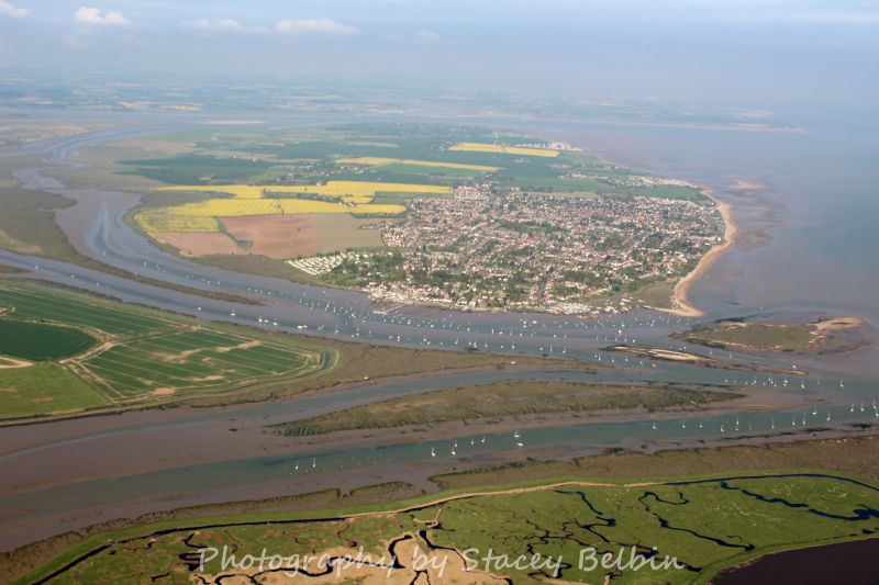  View east from Old Hall Marshes to Mersea Island.

Part of a collection of aerial views of Mersea taken by Stacey Belbin. If you are interested in purchasing any of these photographs, please contact Stacey at ladygraceboat.trips @ gmail.com 
Cat1 Aerial Views-->Mersea