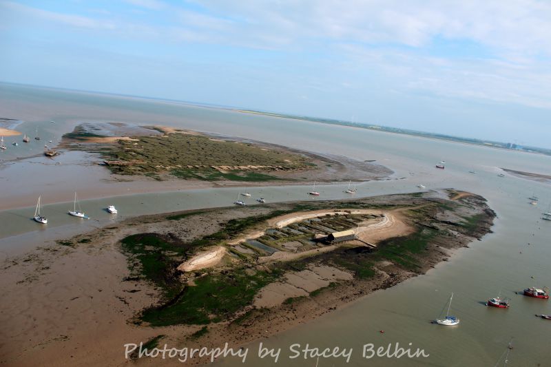 Packing Shed and Packing Marsh Island, with Cobmarsh Island beyond. View southeast.

Part of a collection of aerial views of Mersea taken by Stacey Belbin. If you are interested in purchasing any of these photographs, please contact Stacey at ladygraceboat.trips @ gmail.com 
Cat1 Aerial Views-->Mersea Cat2 Mersea-->Packing Shed