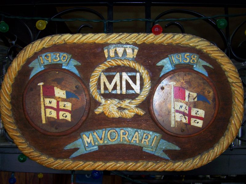  Plaque carved to commemorate MV ORARI of New Zealand Shipping Company 1930 - 1958. The plaque is in the Public Bar of The Kings Head, Tollesbury.

The ORARI was commanded by a Tollesbury man, Captain Nelson Rice, for several years during World War 2. After Captain Rice had died, the plaque was brought to Tollesbury by a former Bo'sun of the ship, Mr. Moxley, who together with two former crew ...
Cat1 Tollesbury-->Pubs