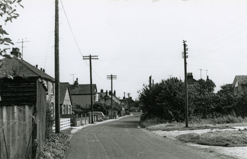  West Street, Tollesbury, looking east. The Shell petrol station is visible in the distance. 
Cat1 Tollesbury-->Road Scenes