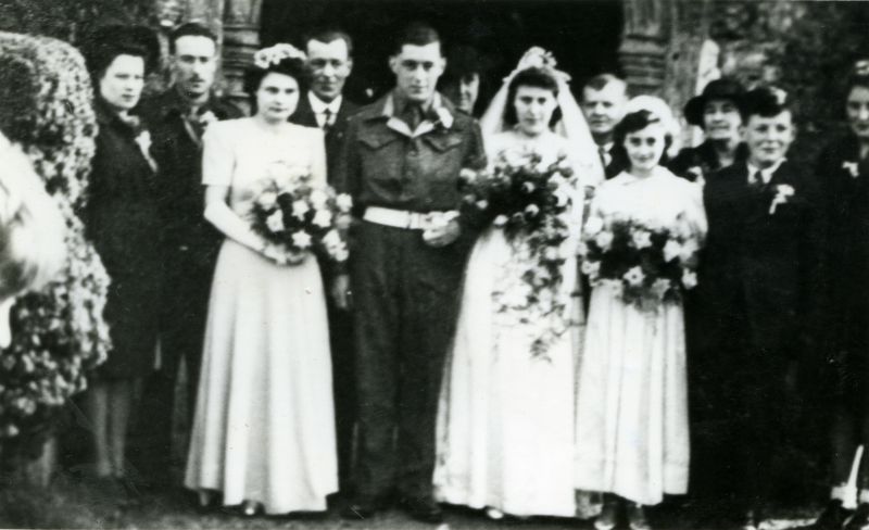  Marriage of Bill Jenkins and Maisie Jenkins née Hewes at St Peter and St Paul, West Mersea. Bridesmaid to the left is Brenda Marshall. Bridesmaid to the right is Ann Maley. Maisie's parents Mr & Mrs Percy Hewes are back right.

William Joseph Jenkins and Marie Constance Hewes.

From Album 1. Accession No. 2016-11-001A 
Cat1 Families-->Hewes