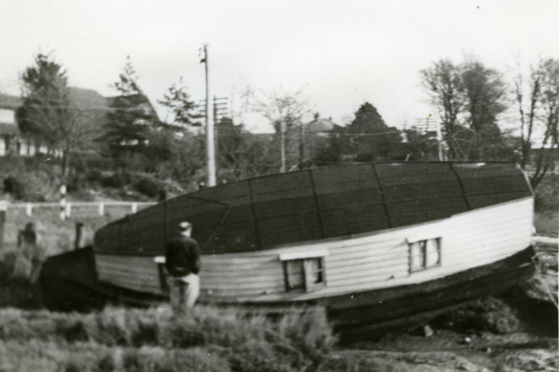  Jack Botham surveying damage to his houseboat WAVENEY after the 1953 flood.

From Album 1. 
Cat1 People-->Other Cat2 Disasters and Mishaps Cat3 Mersea-->Coast Road