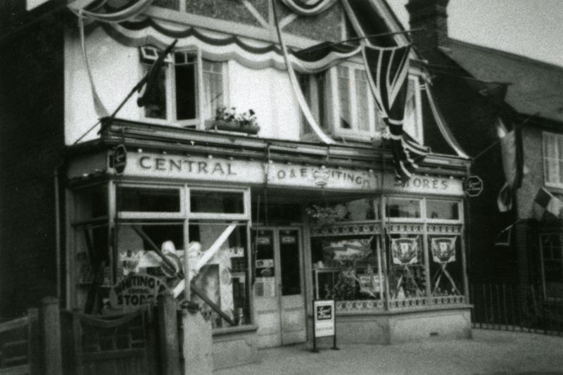  Central Stores. O. & E. Whiting, decorated for the 1953 Coronation.

From Album 2. Accession No. 2016-11-001B 
Cat1 Mersea-->Shops & Businesses Cat2 Mersea-->Events