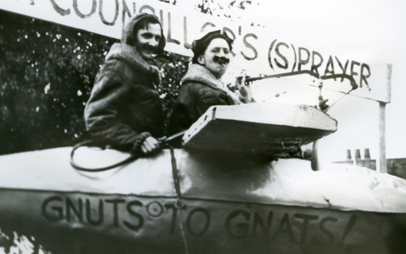 Click to Pause Slide Show


 Councillor's Sprayer. Gnuts to Gnats. 

George Rutherford and Jackie Wells. An obvious reference to Councillor Charles Prigg and his obsession with the mosquito menace on the Island.

Cllr Charles Prigg had suggested spraying the boating lake to control the gnat problem. The fuselage is an old aircraft fuel tank used for long distance flights and jettisoned when empty. This float was on ...
Cat1 Mersea-->Events Cat2 Mersea-->Regatta-->Books Papers