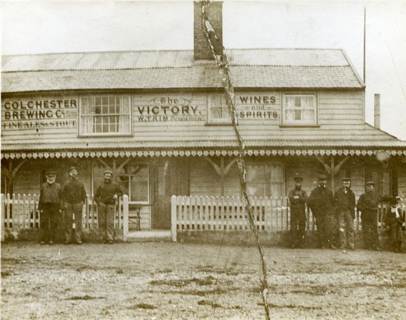  The Victory, old City, West Mersea. Colchester Brewing Co. W. Trim proprietor. Wines & Spirits. 
This pub was closed around 1907 when the new Victory Hotel opened further up Coast Road.

From Album 12. 
Cat1 Mersea-->Pubs Cat2 Mersea-->Old City & the Hard