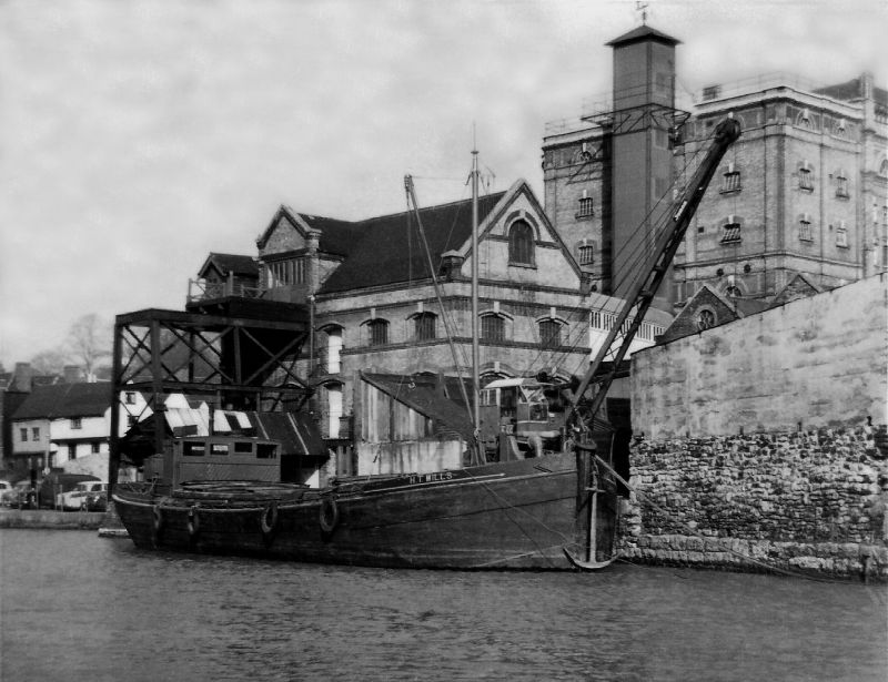  Motor barge H.T. WILLS unloading coal at the small electric power station at Maidstone. H.T. WILLS was built Sittingbourne 1889 for Wills and Packham. Official No. 97712. She was converted to a motor barge by 1950 and by 1993 was a house boat [Sailing Barge Compendium]. 
Cat1 Barges-->Pictures