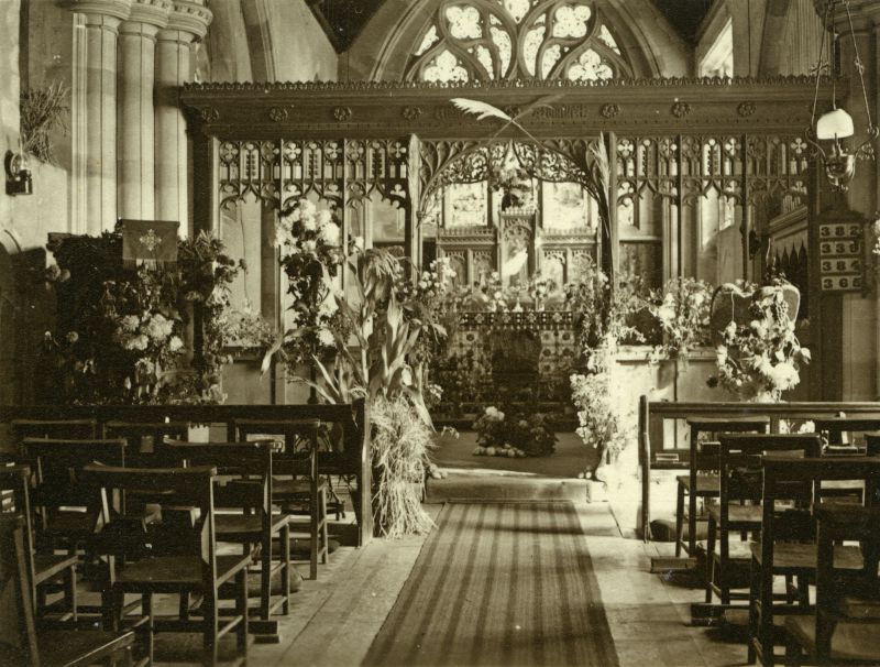  Great Wigborough Church decorated for Harvest Festival. It is inside a Christmas Card from Rev. & Mrs Yates, perhaps dating from the 1940s. There is no electricity - an oil lamp can be seen on the wall on the left of the picture. 
Cat1 Places-->Wigborough
