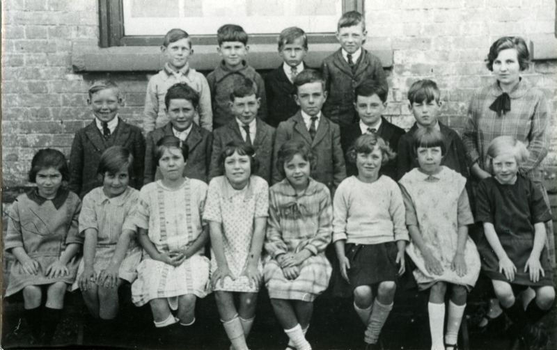  Birch School group around 1925 ?

Back row L-R 1. Cecil Norfolk, 2., 3. Jack Speller, 4. Cecil Cansdale.

Middle row 1. Alfred Taylor, 2. Fred Norton, 3. Ken Vince, 4. Cyril Olley, 5. Raymond Bond, 6. Ted Howard, 7. Miss Barrat.

Front row 1. Joan Everitt, 2. Ivy Cole, 3. Marueen Best or Joyce Symonds ? 4. Gwen Gower, 5. Myrtle Harvey, 6. Joyce Whybrow, 7. Kitty Taylor, 8. Lily ...
Cat1 Birch-->School