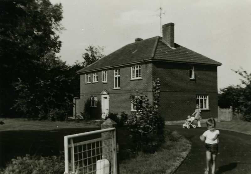 Birch Rectory - at the top of School Hill next to the Village Hall. Susan Millatt with the push chair. The children are from the Blok family from the Netherlands, who had exchanged houses with Rev. George Armstrong.

Photo print is stamped 19.8.69 
Cat1 Birch-->Buildings
