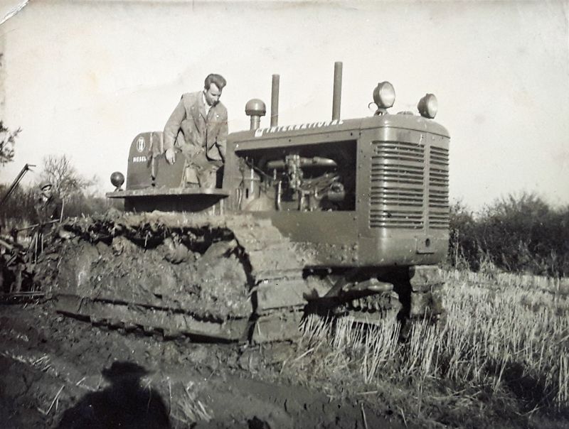  International TD18 crawler tractor. Gordon Purtell is on the tractor and Bernie Ratcliffe behind to the left. Shadow of Victor Gray lower left. New Hall Farm, Little Wigborough.

It was the the first day for the tractor - it had come to the UK for building airfields during WW2 and was khaki underneath the red paint. It was bought from Blackwells at Earls Colne and Victor paid about £945 ...
Cat1 Farming Cat2 Places-->Wigborough