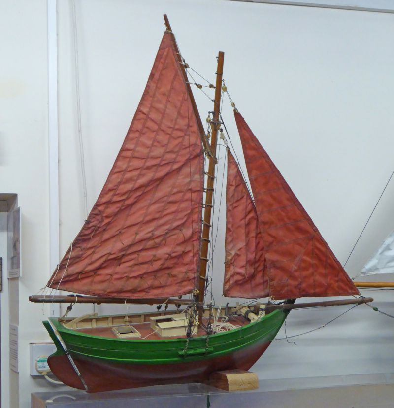  Model of smack BOADICEA CK213 on exhibition in the main hall at Mersea Museum. 


The model was made in the 1950s by Michael Frost who owned BOADICEA for many years. The smack is still in his family and she is still moored at Mersea.



Although it strongly resembles the BOADICEA, in fact it represented his intention to eventually build an improved design with finer lines. The model ...
Cat1 Museum-->Artefacts and Contents Cat2 Smacks and Bawleys