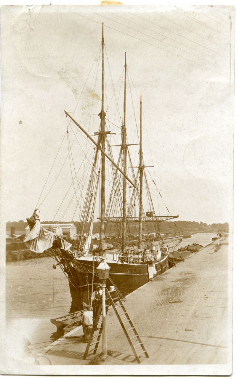  Danish schooner NEPTUN loaded with ice from Norway to Colchester. Thence, in ballast, to St. Johns, Newfoundland, for cargo of fish. 40 day voyage probably. n.b. Back-view of old Hale, the tide-tender, aged 84.

Taken at Colchester Hythe, no date but thought to be 1920s. 
Cat1 Places-->Colchester-->Hythe
