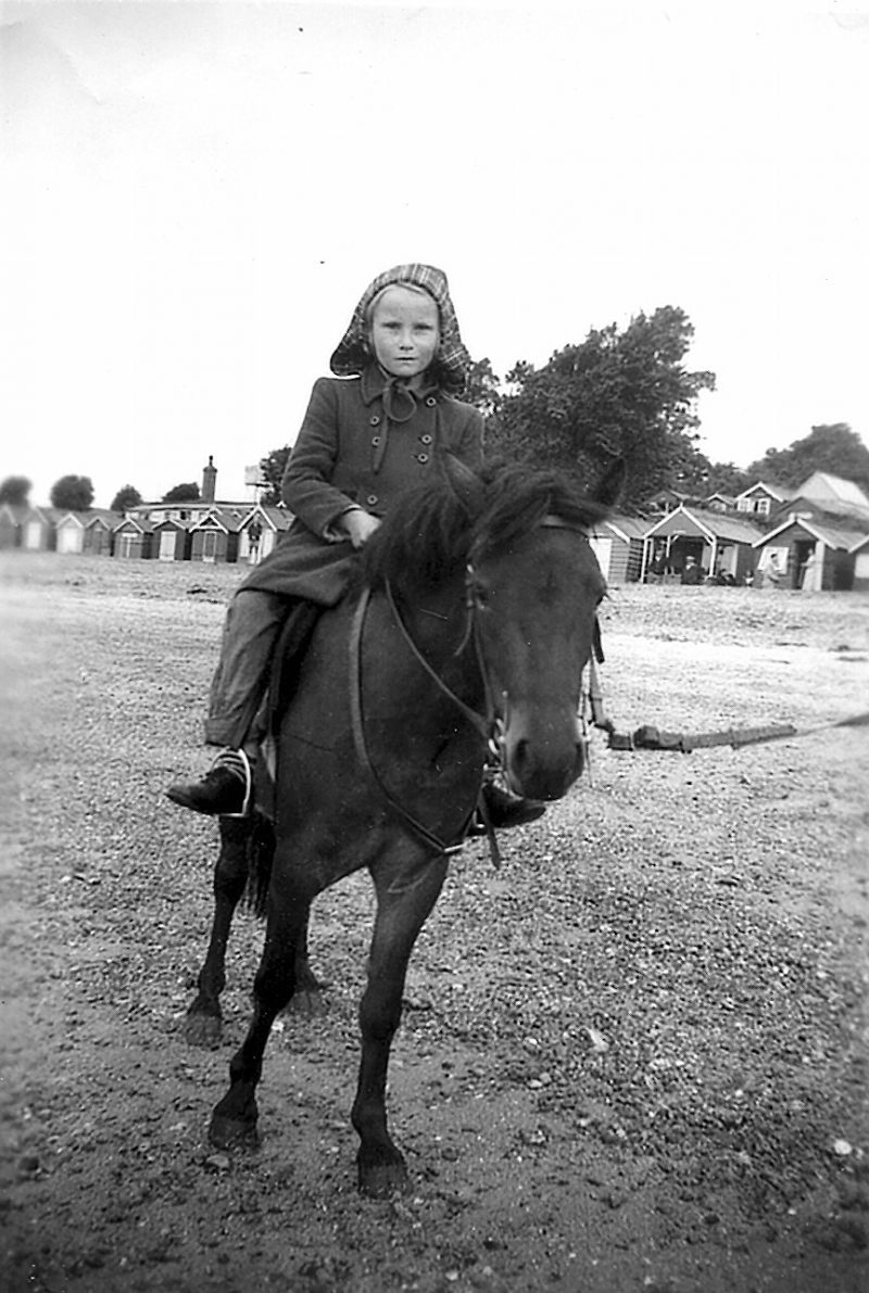  Janice Parrish - Alan Tucker's wife. Mid 1950s. Beach huts and Spinney Cafe behind. 
Cat1 People-->Other Cat2 Mersea-->Beach
