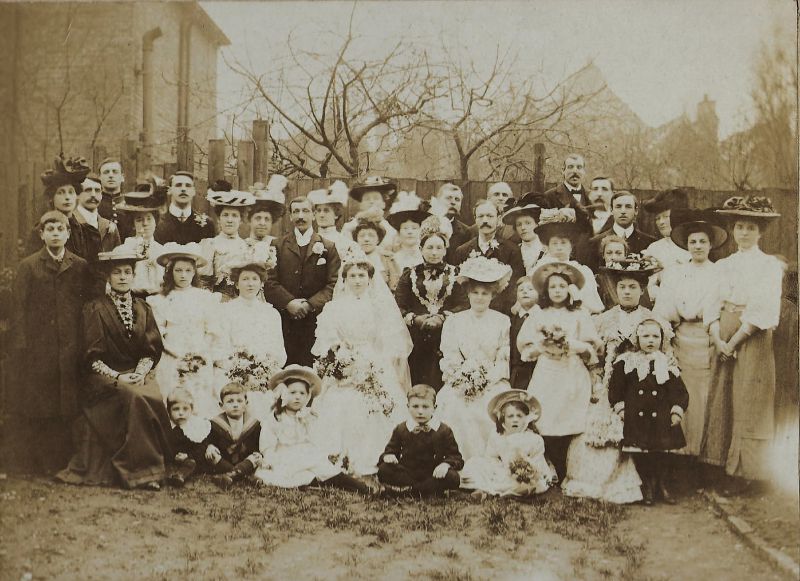 Wedding of George Smith and Edith Head at Mortlake.

George is left of centre with Edith below him to the right. Fanny Head (Edith's mother) is to the right of her wearing dark dress with a white edge to collar. 
Cat1 Families-->Smith