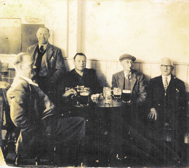  The White Hart. 

The men L-R are Leonard 'Joe' Hewes, Reg Jay (standing), Maurice Jay (Brian's dad), George Milgate and Jack Maylor. The photo, stuck on cardboard, was found in the cellar during an earlier refurbishment. I gave the original to Brian [Ron Green 2019] 
Cat1 Mersea-->Pubs