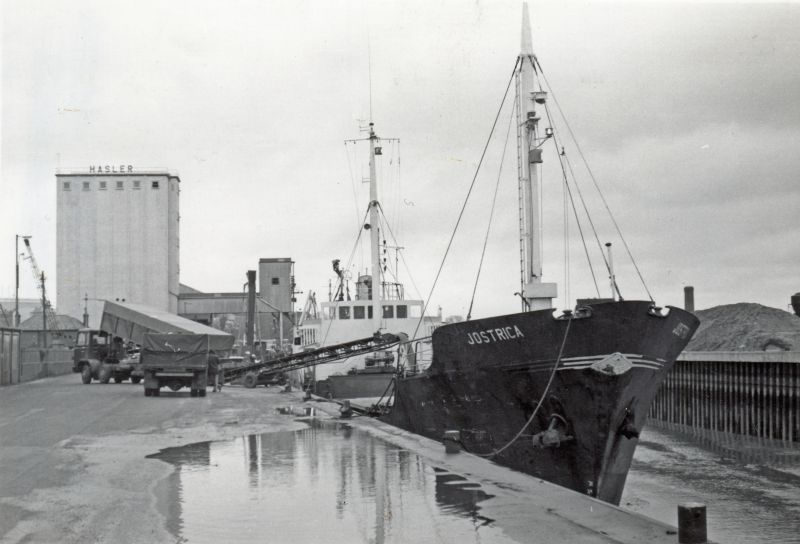  Irish coaster JOSTRICA at Colchester Hythe.

Built as JORGEN PRIESS Solvesborg, Denmark, 1963. Official No. 401535 LR 5405683. Renamed TIMBER SHIPPER 1974, ARKLOW BRIDGE 1976, JOSTRICA 1977. Laid up with engine damage 1985, broken up 1990. 
Cat1 Places-->Colchester-->Hythe Cat2 Ships and Boats-->Merchant -->Power