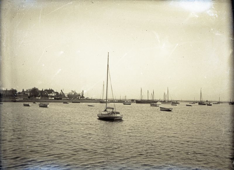 West Mersea Hard, looking southeast out to sea. Journey's End can be picked out towards the left (now West Mersea Yacht Club) and to the right of it a large shed being framed at Clarke & Carter's boat yard.


Quarter plate glass negative. 
Cat1 Mersea-->Old City & the Hard