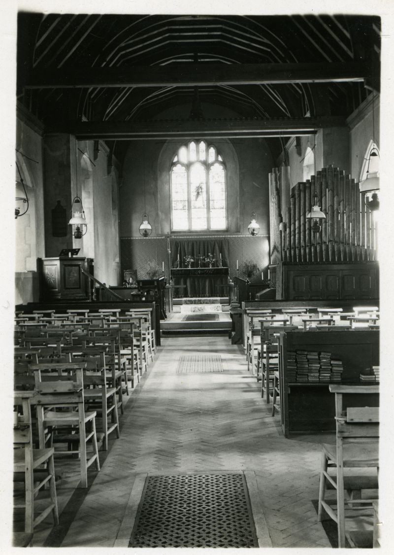  St. Mary's Church, Salcott. 

The church still has oil lamps which will have been replaced in 1941 when electricity was installed. The organ that is shown in the photograph was moved in 1953.

The photograph is thought to be between 1932 and 1942. 
Cat1 Places-->Salcott & Virley