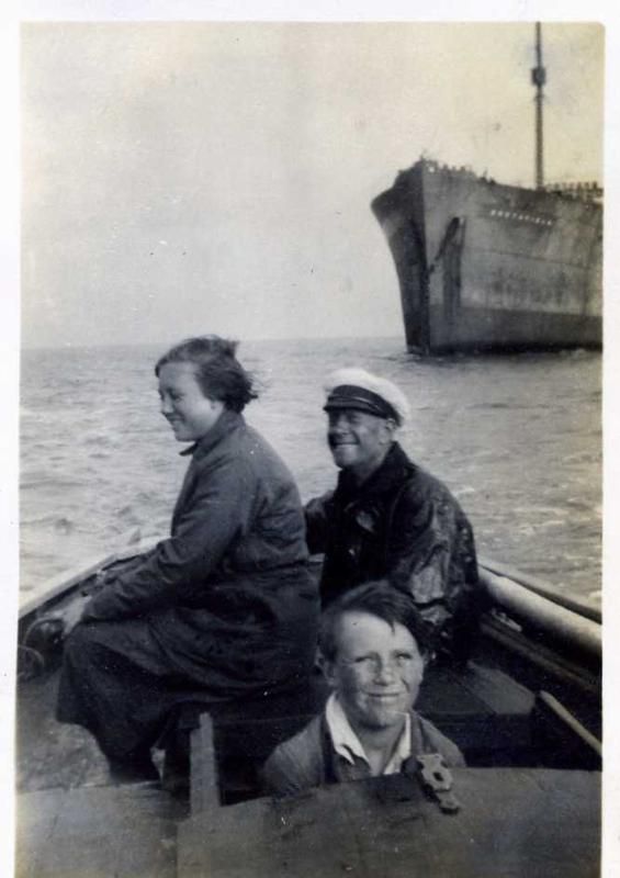  Chum (in cap) daughter Betty Hewes and Jim. Unidentified ship laid up in the River - with a newly repainted 10 letter name. 
Cat1 Families-->Hewes Cat2 People-->Other