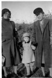  Aunty Loo-Grant, Robert Pullen and Blanch.

From Bob Pullen:

Aunty Loo was Louie Hewes, married to Alan Grant. They lived at Chichester for a long time, but Loo returned to Mersea for her retirement. Blanch is Blanch Green, married to Joe Hewes, Louie's brother. This was probably taken at Birdham when I was about 4. I had no control over my wardrobe, which I think was a mustard colour! 
Cat1 Families-->Hewes Cat2 People-->Other