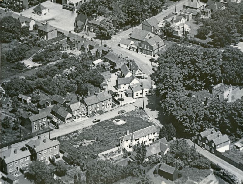  Jack Botham aerial photograph 3221. Church Road, High Street, bus station, White Hart. West Mersea church on the right. 
Cat1 Aerial Views-->Mersea