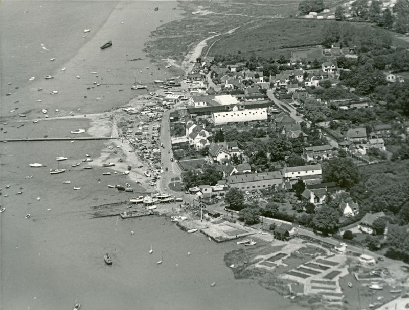  Jack Botham aerial photograph 3110. Coast Road, the Hard. The hulk on the mud upper left is the PIONEER before she was rescued. 
Cat1 Aerial Views-->Mersea Cat2 Mersea-->Coast Road Cat3 Mersea-->Old City & the Hard